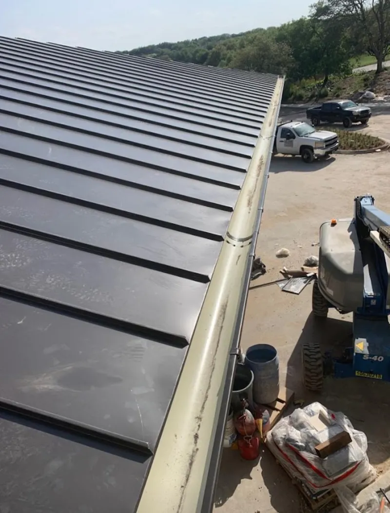 Standing seam panel and gutter detail on a metal roofing jobsite in Lower Heidelberg